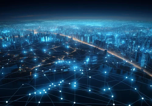 Aerial view of a futuristic city lit in blue lights and interconnected networks.